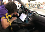 An attendee of last weekend’s 2019 Defcon cybersecurity event in Las Vegas is seen at the conference's car-hacking village.