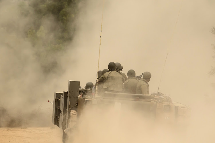 Israeli armored personnel carriers drive towards the Gaza Strip, near the city of Sderot in Israel, October 9 2023. Picture: AMIR LEVY/GETTY IMAGES