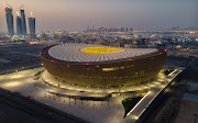An aerial view taken by dron of Lusail Stadium in Doha, Qatar at sunrise on June 20 2022. The 80,000-seat stadium, designed by Foster + Partners studio, will host the final game of the Fifa World Cup Qatar 2022.