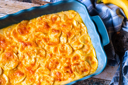 Keto Squash Casserole with melted cheese on top.