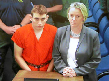 Nikolas Cruz appears via video monitor with Melisa McNeill, his public defender, at a bond court hearing after being charged with 17 counts of premeditated murder, in Fort Lauderdale, Florida, on February 15 2018. Picture: REUTERS