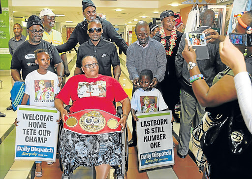 HERO’S WELCOME: IBF champion Zolani ‘Last-born’ Tete welcomed by friends and family at the East London Airport after beating Paul Butler in in his own backyard in United Kingdom Picture: FILE