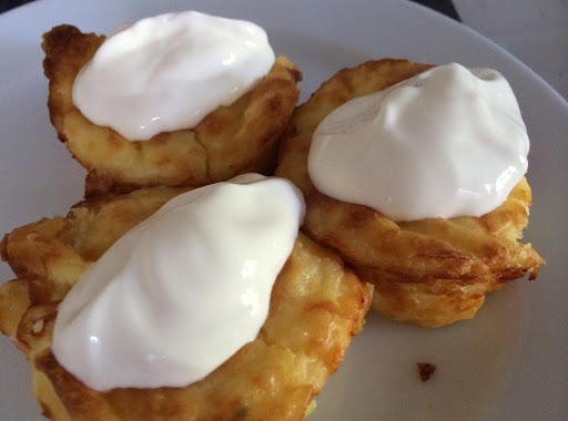 Pepper Jack Puffs garnished with a dollop of sour cream.