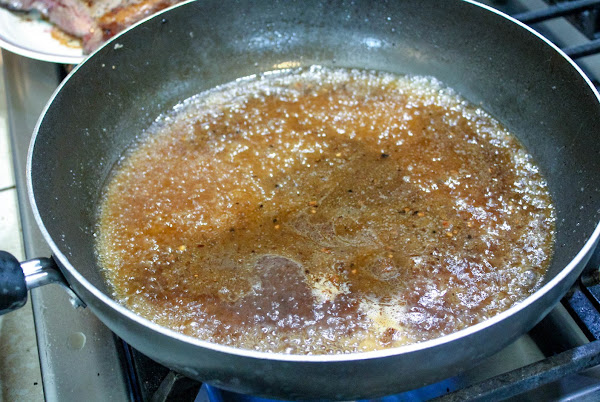 Beef broth and water in a pan.