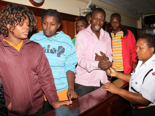 Part of the seven suspects who were charged with the murder of former Kabete MP George Muchai at the Milimani Law court on March 13, 2015.