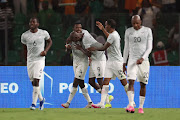 Teboho Mokoena celebrates scoring Bafana Bafana's equaliser from the penalty spot with Evidence Makgopa and other teammates in their Africa Cup of Nations semifinal against Nigeria at Stade de la Paix in Bouake, Ivory Coast, on Wednesday night.