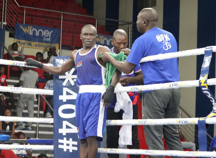 Hit Squad captain Nick Okoth receiving some tips from head coach Benjamin Musa and assistant coach Dave Munuhe during the Africa Zone 3 Championship in Kinshasa Congo.