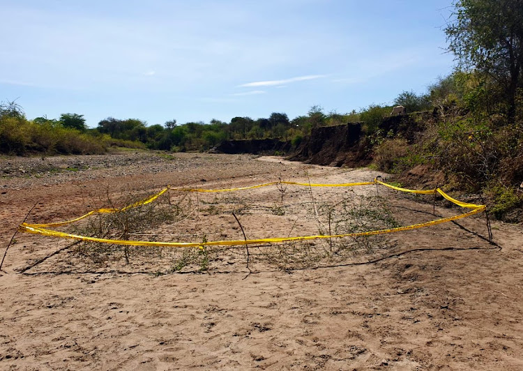 A scene where Farther Michael Maingi's body was exhumed along Mashamba River at Makima location in Mbeere South, Embu County on Wednesday.