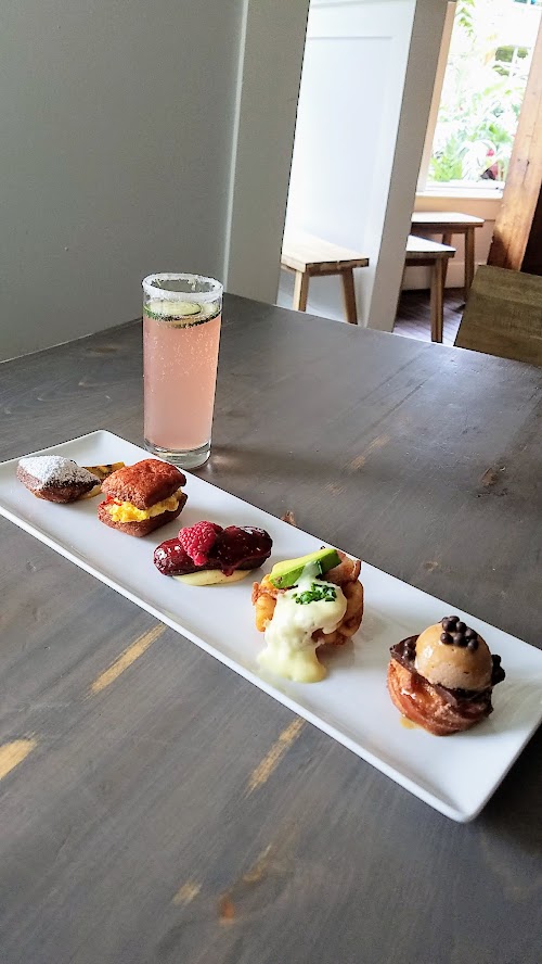 My first look at Outer Darkness Donuts, which on offer here only on Sundays are dark roast drip coffees, fun mimosas, loose leaf tea, and only one food dish you can order: a flight of mini-donuts.