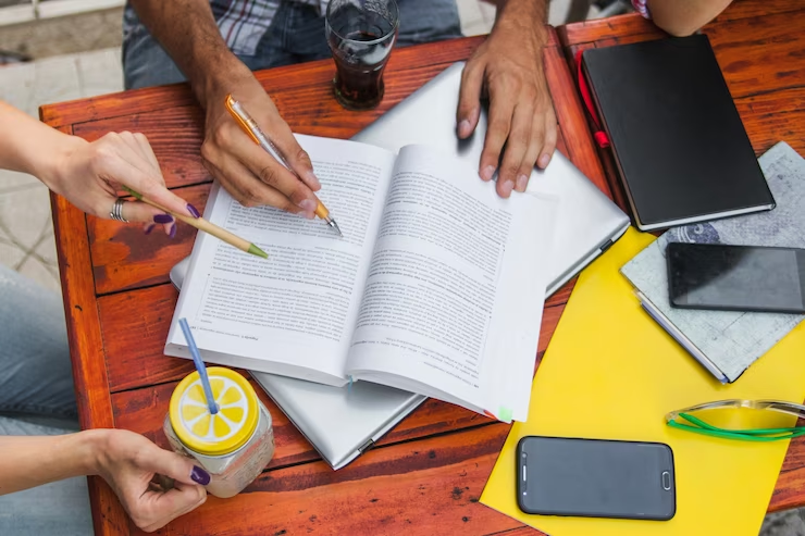 Focused individuals studying for the UKiset Test.