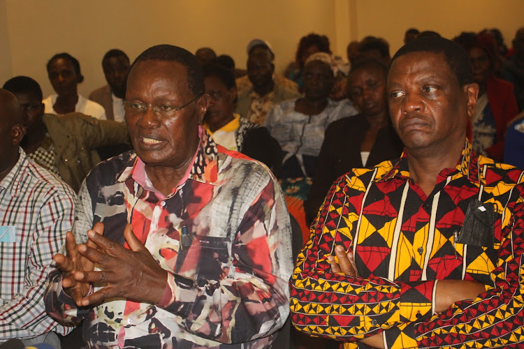 Kisii governor aspirant Chris Obure with his running mate William Mbaka during a meeting at a Kisii hotel