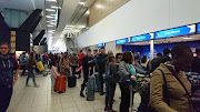 People queuing at the check-in at OR Tambo International Airport in Johannesburg on 26 April 2017.