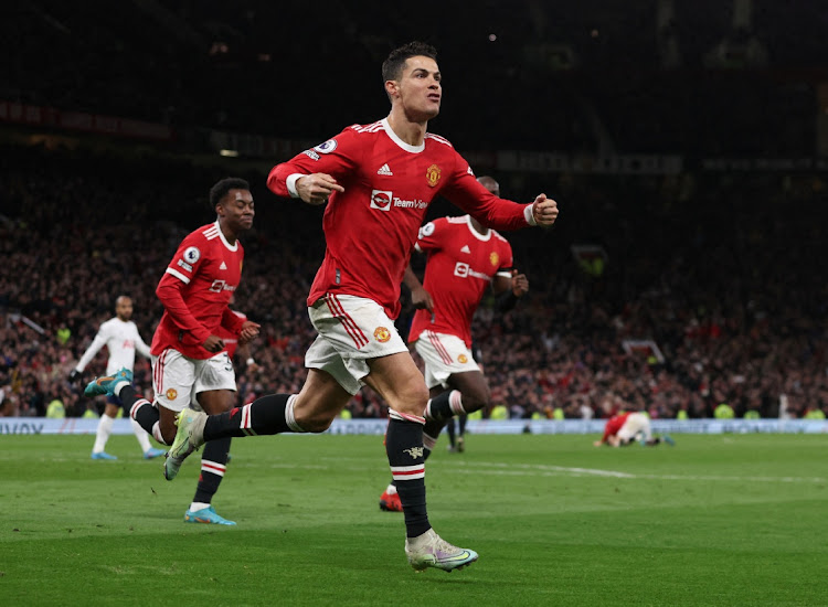 Manchester United's Cristiano Ronaldo celebrates scoring his third goal against Tottenham on Saturday.