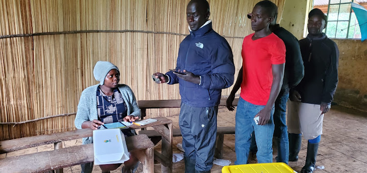 Party members queue to vote in UDA grassroots elections at a polling centre in West Karachuonyo on April 26, 2024.