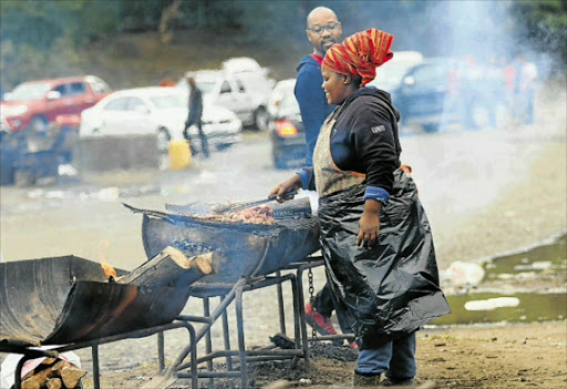 SIZZLING: Meat being braaied at Ebuhlanti, one of East London’s best-loved braai places Picture: MICHAEL PINYANA