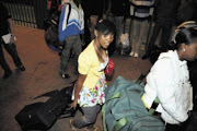 MARCHING: Prudence Kau, one of the SANDF recruits, prepares to board a train to the army training base in Kimberley. PHOTO: VATHISWA RUSELO. 10/01/2010. © Sowetan.

10/01/2010. Prudence Kau ,  one of the 2009 matriculants who were recruited by the SANDF prepares to board a train to the SA army training base in Kimberley. PHOTO: VATHISWA RUSELO