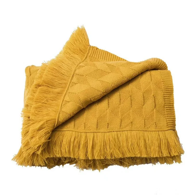 Couverture de lit unie style nordique avec pompons, luxe américain pour chambre, hôtel ou B&B. Décoration élégante et confort optimal.