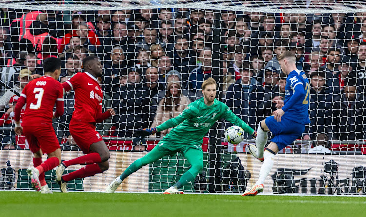 Chelsea's Cole Palmer in action with Liverpool goalkeeper Caoimhin Kelleher