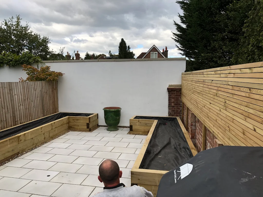 Album cover: Symmetrical planters and patio /horizontal  batten fencing