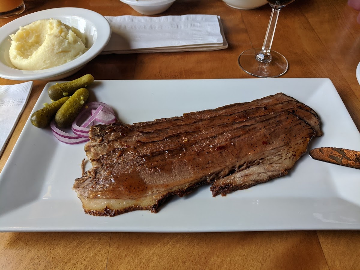 Smoked brisket platter. The house-made BBQ sauces are GF.