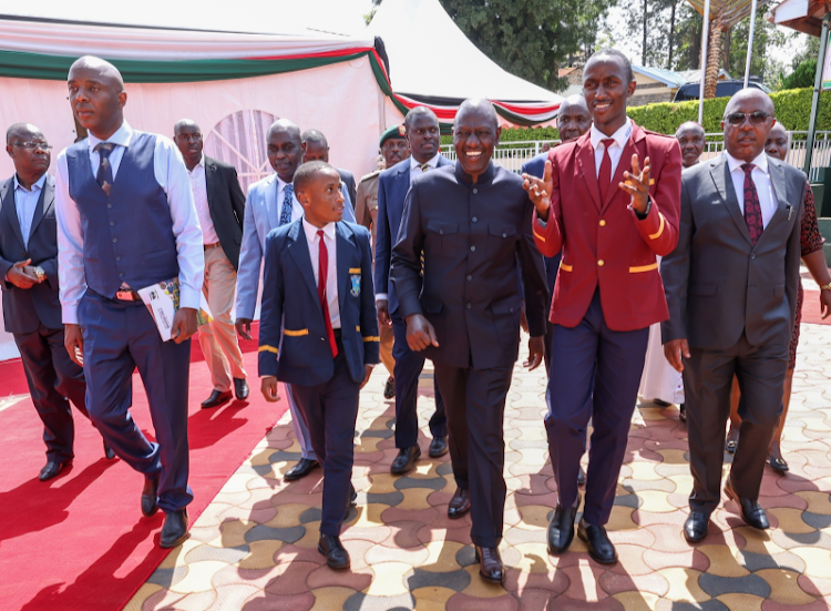 President William Ruto with Murang'a High School students when he commissioned a multi-purpose hall at the school on July 21, 2023.