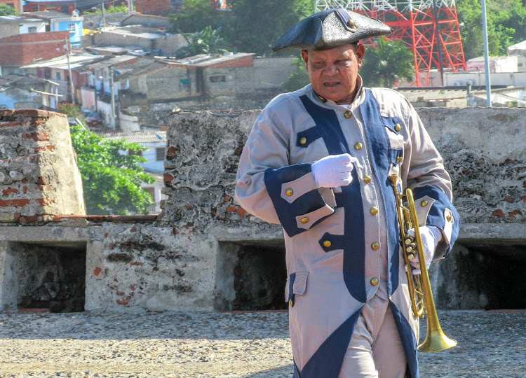 A trumpeter in period garb at Castillo San Felipe de Barajas in Cartagena, Colombia. 