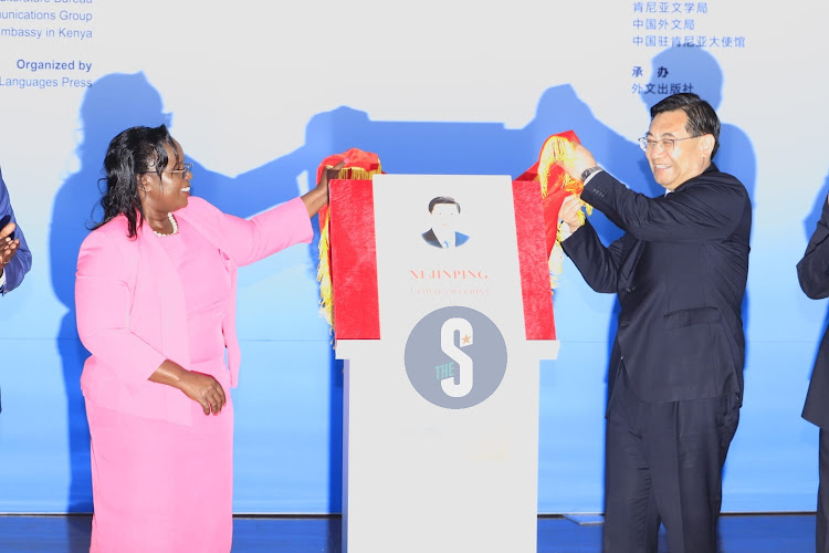 Tourism, Wildlife, and Heritage Cabinet Secretary, Peninah Malonza with Minister of culture and tourism in China, Hu Heping, unveiling the Swahili edition of Xi Jinping: The Governance of China ( volume 1) at the University of Nairobi on August 14, 2023.