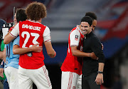 Pierre-Emerick Aubameyang, David Luiz and manager Mikel Arteta celebrate after the match.