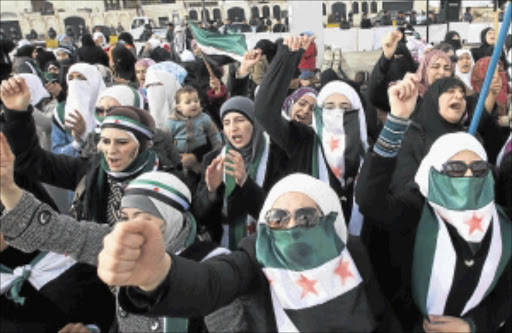 ENOUGH: Syrians living in Jordan shout slogans during a demonstration against Syrian President Bashar al-Assad after Friday prayers in front of the Syrian Embassy in Amman last week. PHOTO: REUTERS