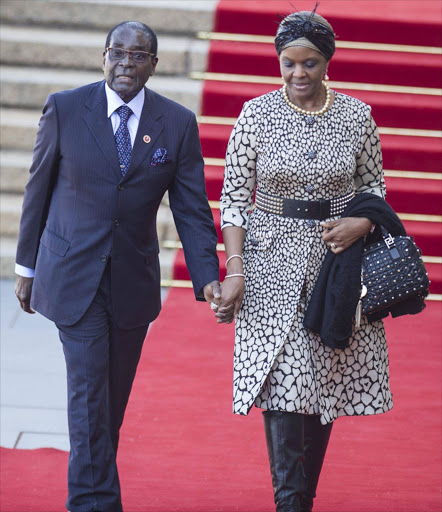 The President of Zimbabwe Robert Mugabe and his wife Grace arrive at the inauguration of the President Jacob Zuma at the Union Building in Pretoria. EPA/MUJAHID SAFODIEN