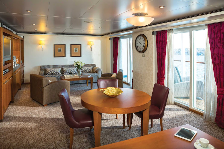 At 876 total square feet, the Grand Suite on Seven Seas Voyager features 1 1/2 marble bathrooms, a private balcony, spacious bedroom and expansive living room. 