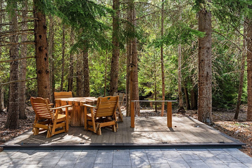 Wooden table and chairs, forest deck - Buy this luxury property in Naples, 2 bedrooms