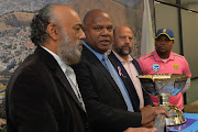 Cricket South Africa head of media and communications Thamie Mthembu (far right) poses for a photograph with the Mzansi Super League trophy with then Western Province Cricket Association CEO Nabeal Dien (left) Cape Town Mayor Dan Plato (second left) Cricket South Africa transformaion officer Max Jordaan (second right) during the Cape Town Blitz meet and greet with Mayor of Cape Town at City of Cape Town Offices on October 28, 2019.