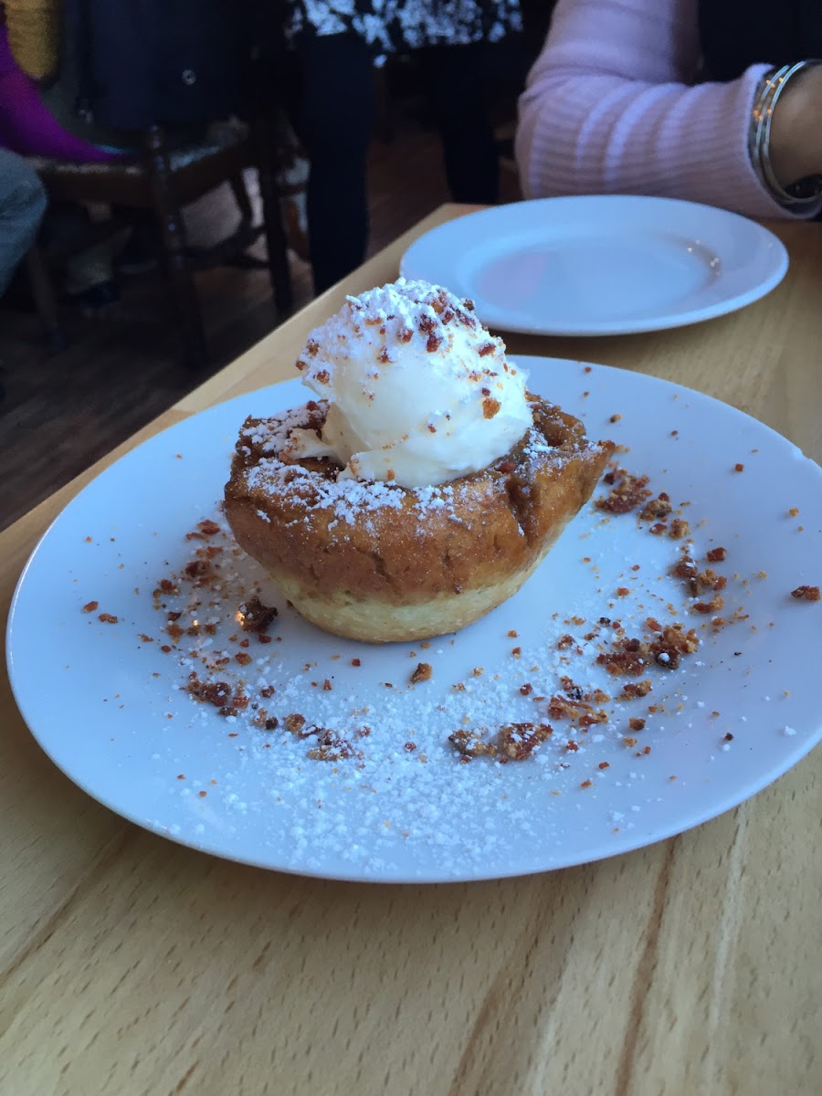 Gluten free pumpkin cinnamon roll with bacon dust.