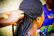 Black girl getting her hair braided Picture: Free Stock Image/Pixabay