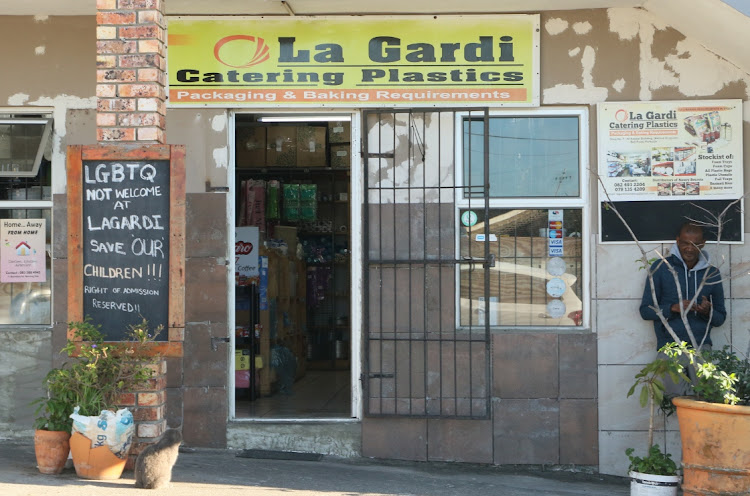 A sign outside La Gardi barring LGBTQ+ individuals from entering the store. Stock image.