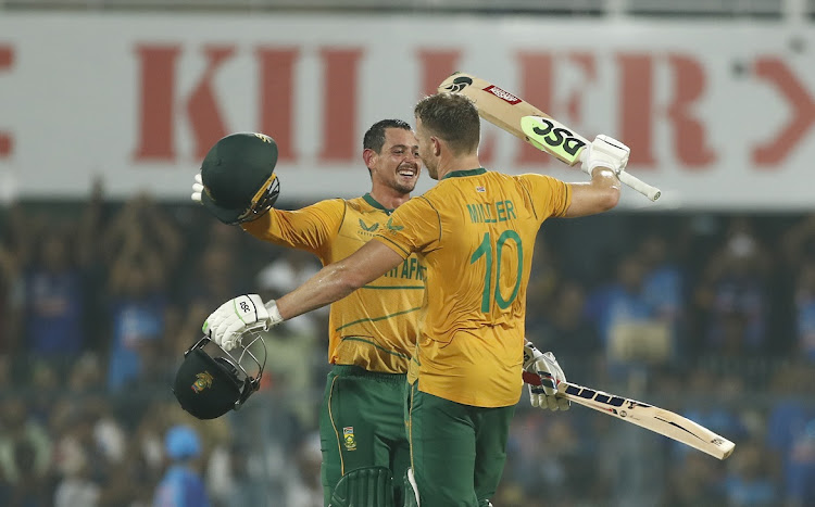 SA's David Miller celebrates his century with teammate Quinton de Kock in the second T20 international against India at Barsapara Cricket Stadium in Guwahati.