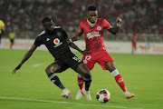 Shomari Kapombe of Simba is challenged by Deon Hotto of Orlando Pirates in the Caf Confederation Cup quarterfinal at Benjamin Mkapa National Stadium in Dar es Salaam, Tanzania.