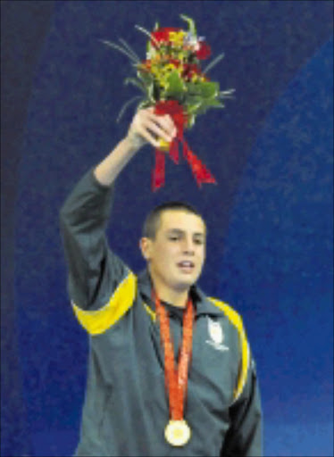 BEIJING, CHINA - 8 September 2008, Charl Bouwer with his Gold Medal in the 400m Freestyle S13 during Day 2 of the Swimming Finals, 2008 Beijing Paralympic Games held in Beijing, China.\nPhoto by Duif du Toit / Gallo Images\n\nSURPRISED; Charl Bouwer with his gold moedal in the 400m freestyle S13. page 35, sow 09/08.