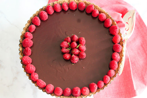 Chocolate Raspberry Tart ready to be sliced.