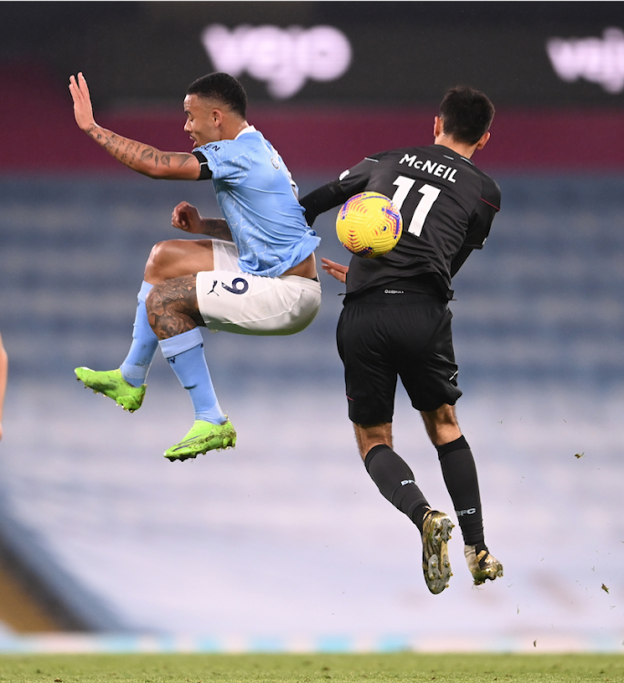 Burnley's Dwight McNeil in action with Manchester City's Gabriel Jesus