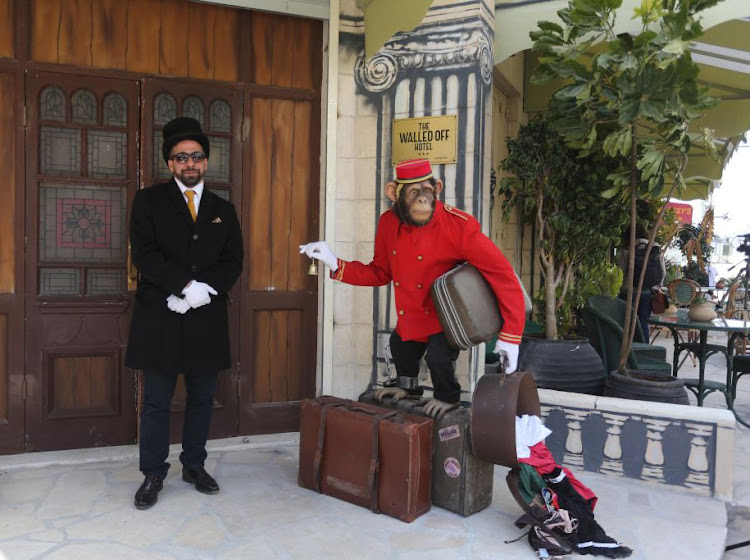 A model monkey carrying bags is seen outside the hotel