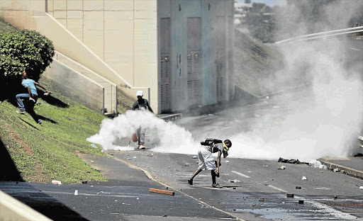 WAR ZONE: Students engage in violent protest action over financial aid on the University of KwaZulu-Natal's Westville campus this week Picture: TEBOGO LETSIE
