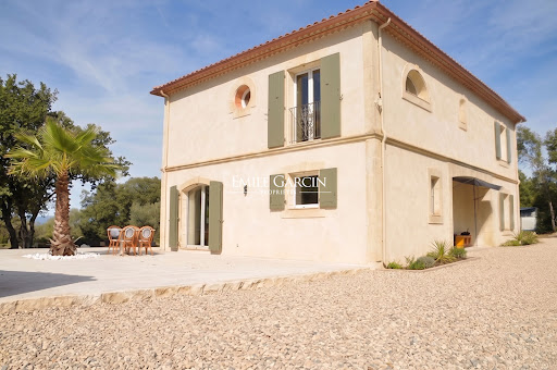 Cream house with green shutters, terrace and palm tree in this luxury property for sale in Nimes ($781,170 - 170 m²)