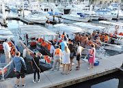 Tourists board boats as the coronavirus disease (Covid-19) pandemic continues in Cabo San Lucas, Mexico, January 3, 2022. 