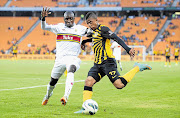 Pretoria University's Tebogo Monyai tries to foil Kaizer Chiefs forward George Lebese's effort at goal during their clubs' Absa Premiership clash at Soccer City on Saturday. The match ended in a 1-1 draw