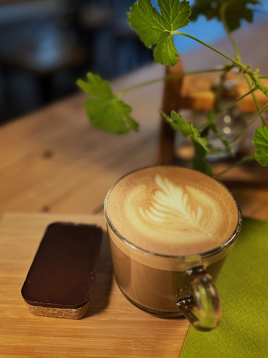 Our 'healthy' Millionaire Shortbread is made with flax, oat, cacao,  and unrefined sugar and is addictively delicious! Served with an oat milk latte.