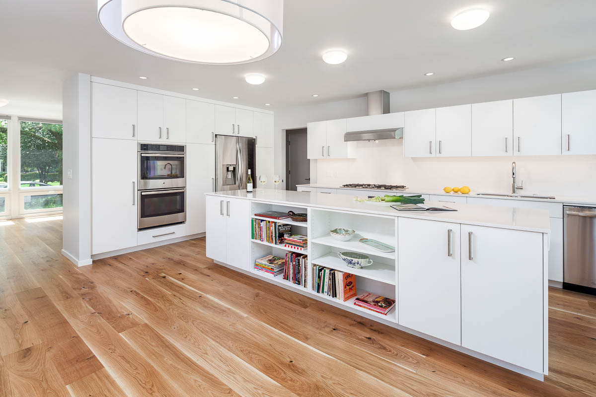 kitchen with white cabinets and oak flooring