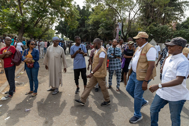 Former President Uhuru Kenyatta and the team of election observers at a polling station in Abuja, Nigeria on February 25,2023.