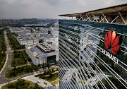 The Huawei logo is seen on the side of the main building at the company's production campus in Dongguan, near Shenzhen, China.